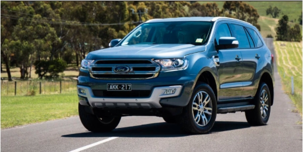 Ford everest parked in the center of a rural road