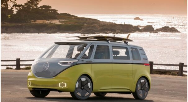 Volkswagen bus with surfboards on top