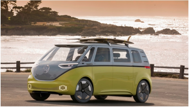 Volkswagen bus with surfboards on top